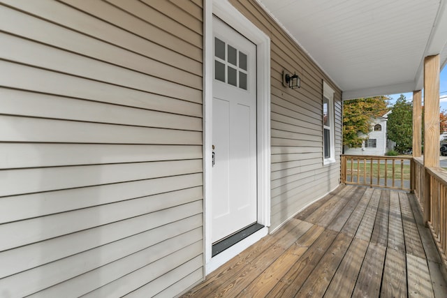 wooden deck featuring covered porch