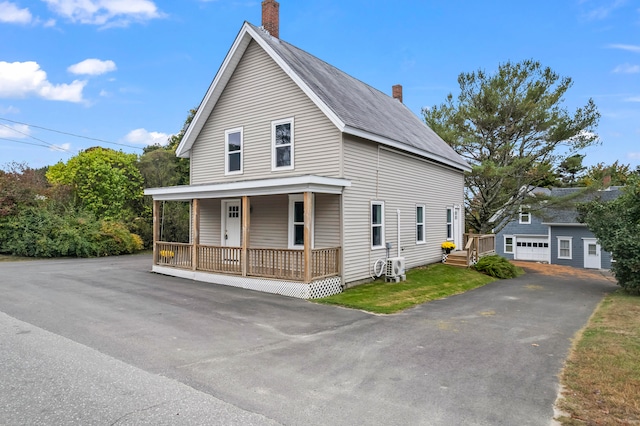 view of front of home with a porch and a garage