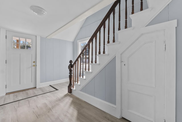 5 Harbor Rd, Friendship, ME 04547 - entryway featuring wood finished floors, healthy amount of natural light, lofted ceiling, stairway, and a decorative wall