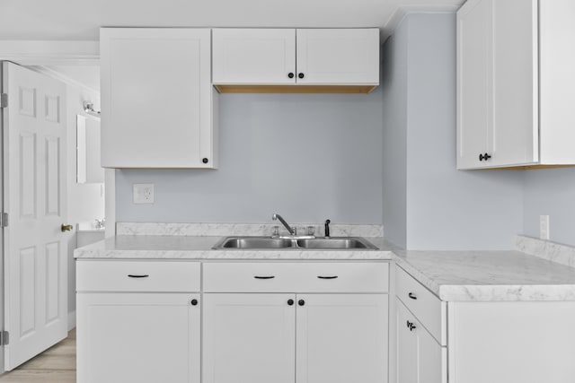 5 Harbor Rd, Friendship, ME 04547 - kitchen with a sink, white cabinetry, light countertops, and light wood-style flooring
