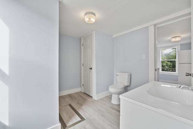5 Harbor Rd, Friendship, ME 04547 - bathroom featuring wood finished floors, toilet, vanity, and baseboards