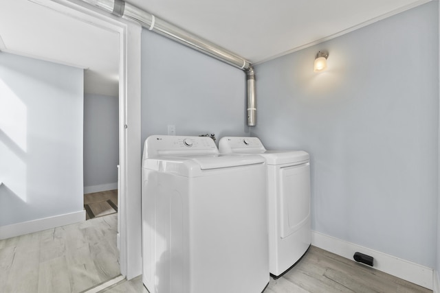 5 Harbor Rd, Friendship, ME 04547 - laundry room with separate washer and dryer, baseboards, and wood finished floors