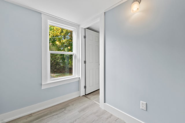 empty room with light hardwood / wood-style flooring