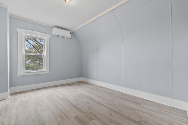 5 Harbor Rd, Friendship, ME 04547 - unfurnished room featuring a wall unit AC, wood finished floors, and baseboards