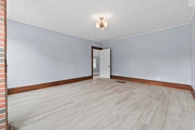 empty room with light hardwood / wood-style floors