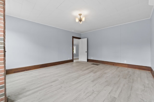 5 Harbor Rd, Friendship, ME 04547 - spare room with wood finished floors, a chandelier, and baseboards