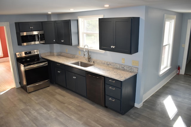 kitchen featuring light hardwood / wood-style floors, sink, and stainless steel appliances