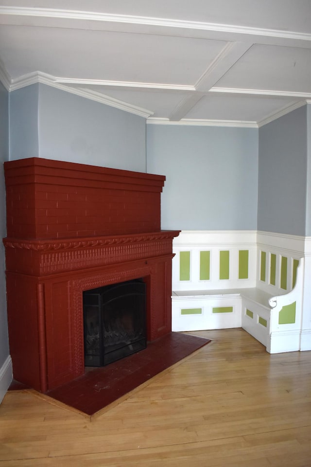 unfurnished living room with light hardwood / wood-style floors and crown molding