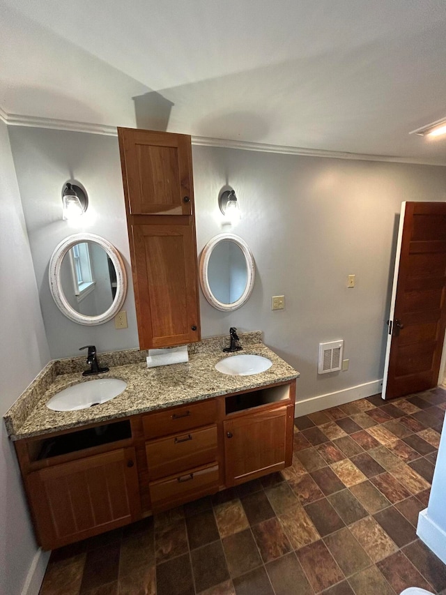 bathroom featuring vanity, lofted ceiling, and ornamental molding