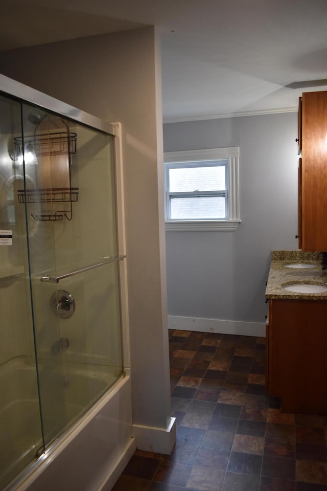 bathroom with vanity and enclosed tub / shower combo