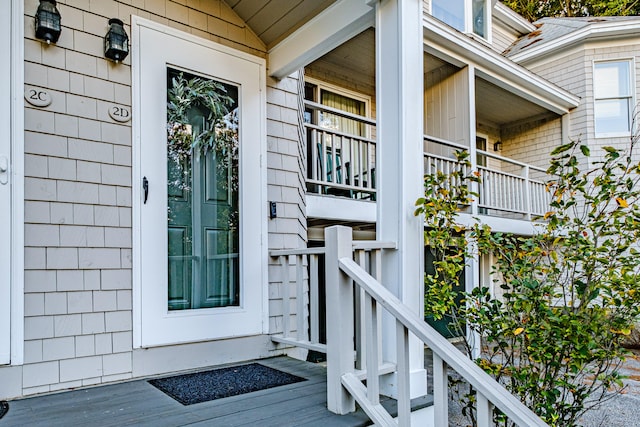 entrance to property with a balcony