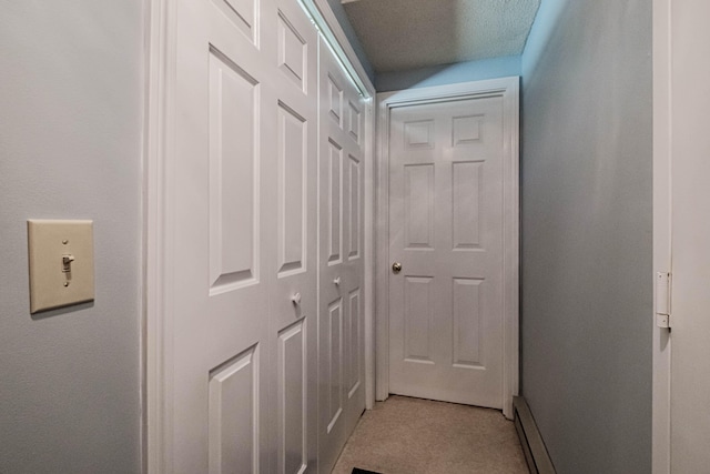 hallway featuring a textured ceiling