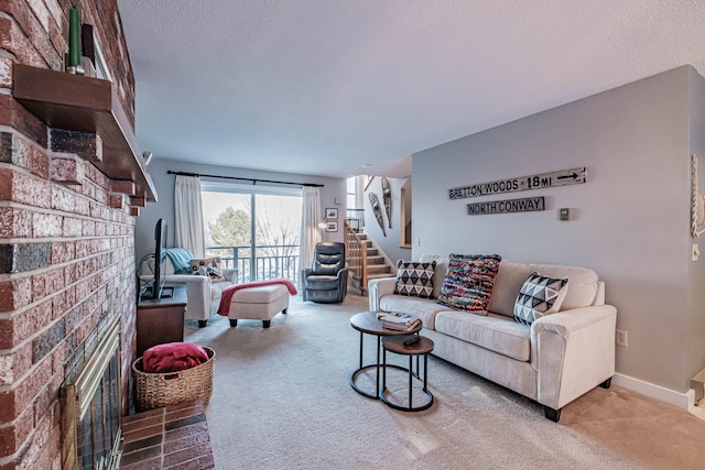 carpeted living room featuring a textured ceiling