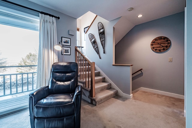 interior space with lofted ceiling and carpet