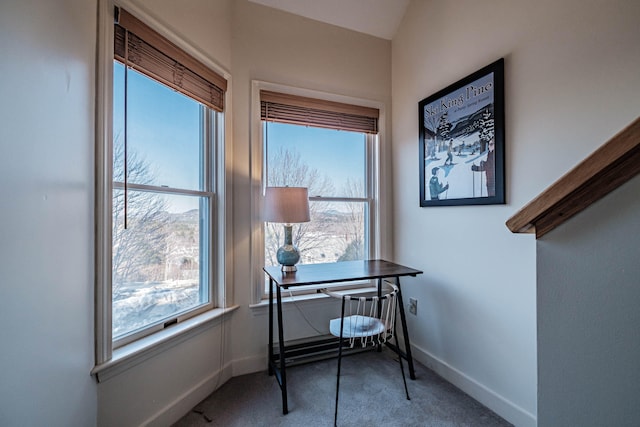 office area featuring a wealth of natural light, carpet, and a mountain view