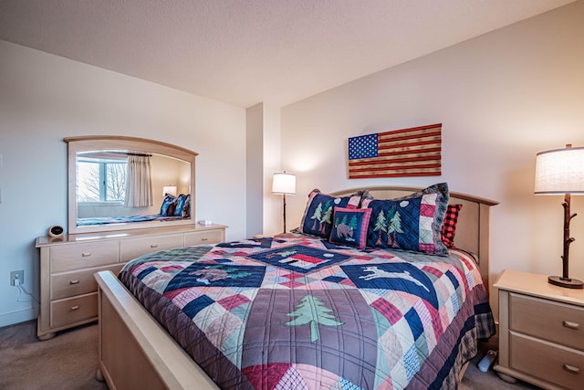 carpeted bedroom with a textured ceiling