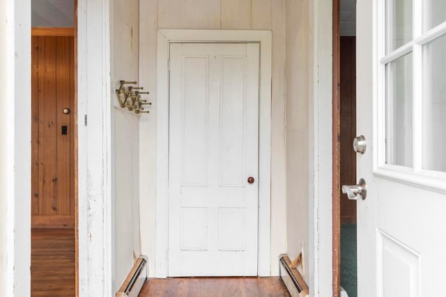 doorway to property with a baseboard radiator