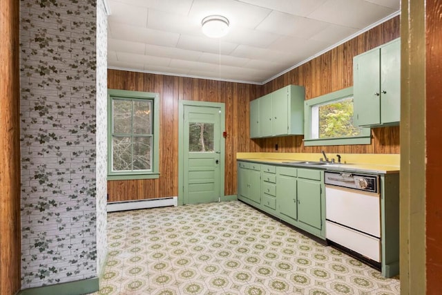 kitchen with wooden walls, dishwasher, sink, and a baseboard radiator