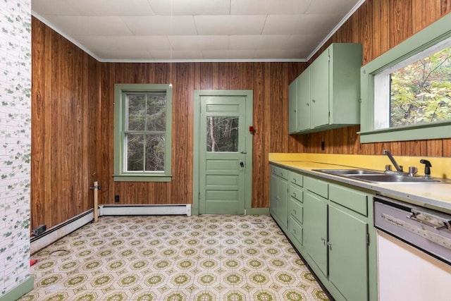 kitchen with crown molding, a baseboard heating unit, sink, and white dishwasher