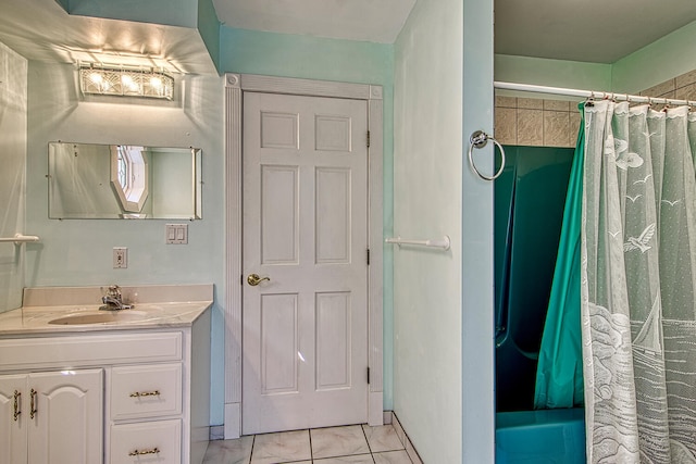 bathroom with shower / tub combo with curtain, tile patterned floors, and vanity