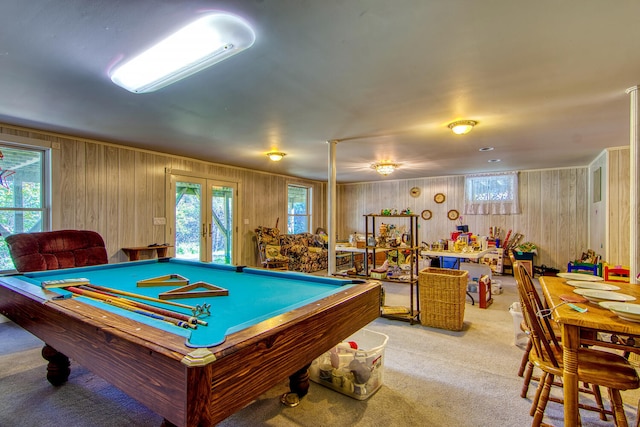 playroom featuring light carpet, wood walls, and billiards