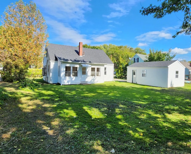 back of house with a yard