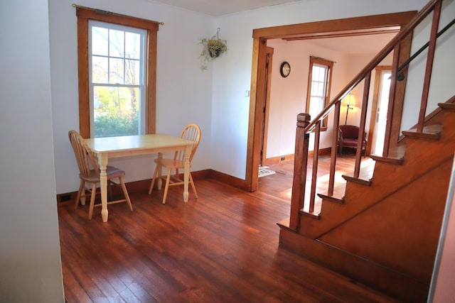 dining area with dark wood-type flooring