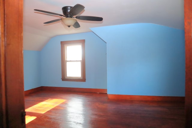 bonus room featuring dark wood-type flooring, ceiling fan, and lofted ceiling