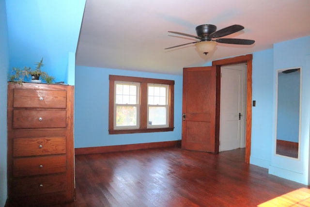 unfurnished bedroom featuring dark hardwood / wood-style floors and ceiling fan