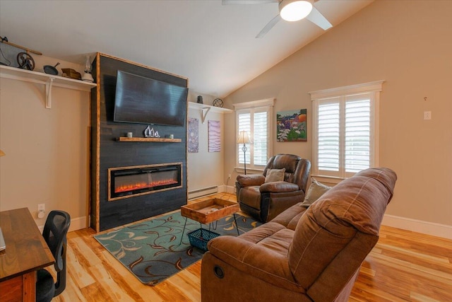 living room featuring light hardwood / wood-style flooring, a baseboard radiator, high vaulted ceiling, a large fireplace, and ceiling fan