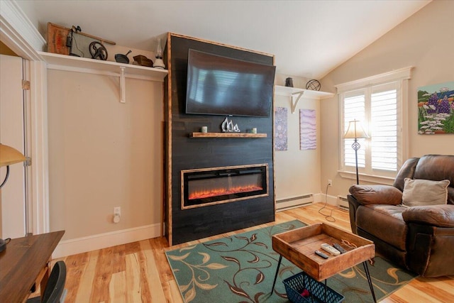 living room featuring baseboard heating, vaulted ceiling, and light hardwood / wood-style flooring