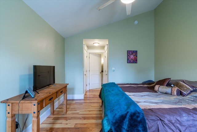 bedroom with light wood-type flooring, lofted ceiling, and ceiling fan