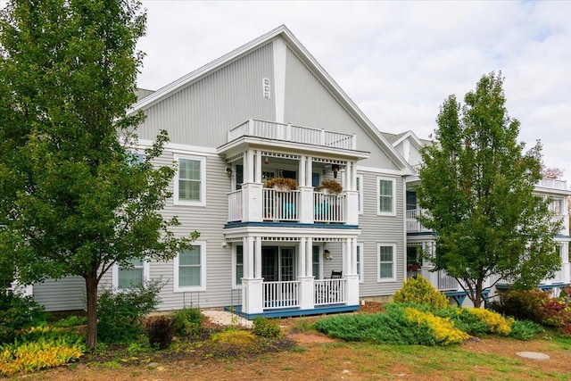 rear view of house featuring a balcony