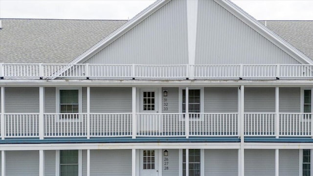 rear view of property with a balcony