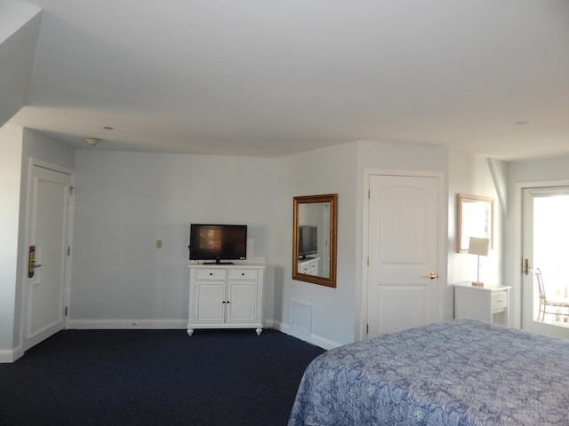 bedroom featuring dark colored carpet