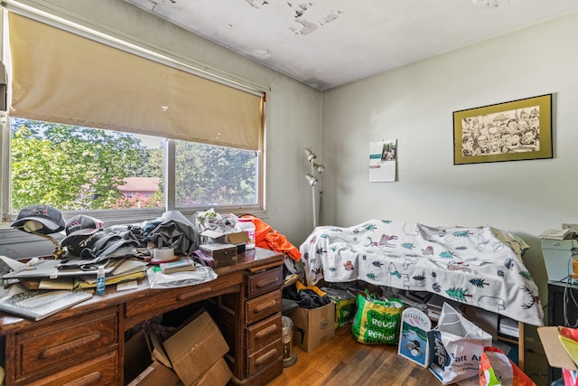 bedroom with dark hardwood / wood-style floors