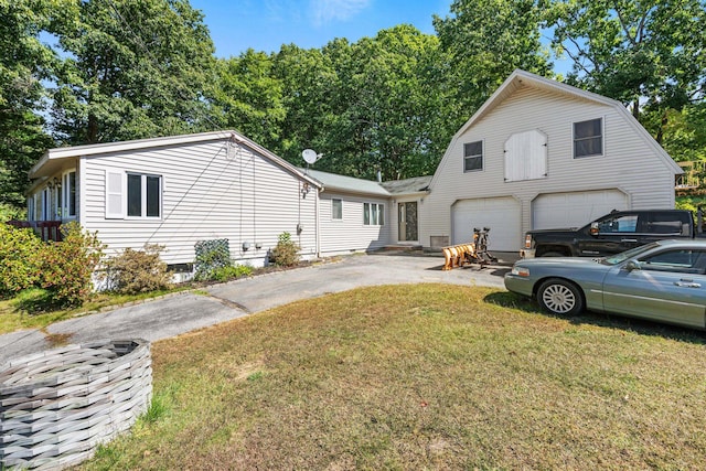 view of front of property with a garage and a front yard