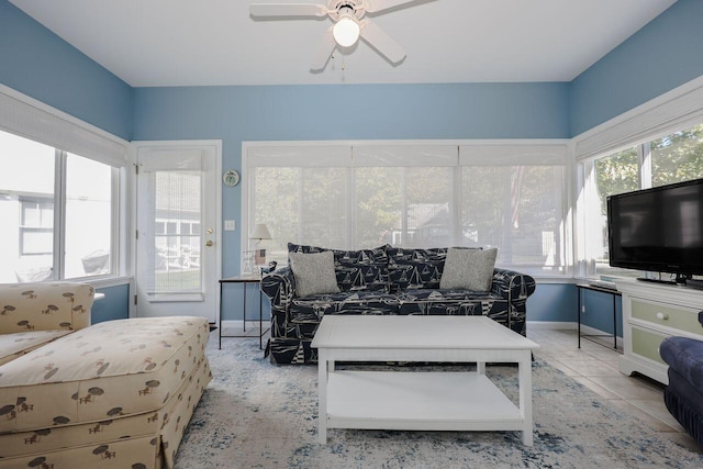 tiled living room featuring ceiling fan