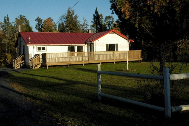 back of property with a lawn