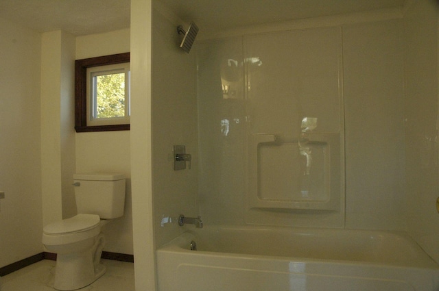 bathroom with  shower combination, tile patterned flooring, and toilet