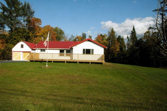 view of yard featuring a storage shed and a wooden deck