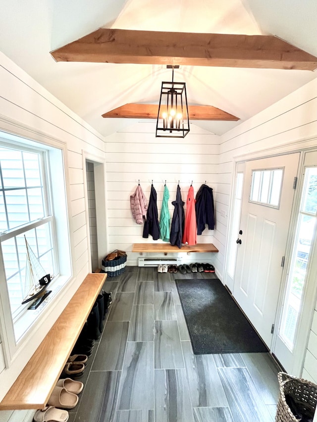 mudroom with lofted ceiling with beams, a healthy amount of sunlight, wood walls, and a chandelier