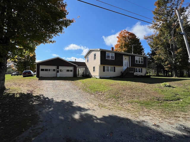 split foyer home with a garage and a front yard