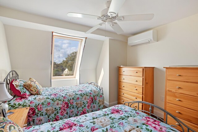 143 Beach Ave Unit 203, Kennebunk, ME 04043 - bedroom with an AC wall unit, a ceiling fan, and baseboards