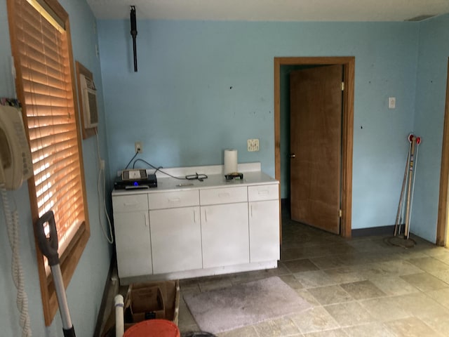clothes washing area with a wall unit AC
