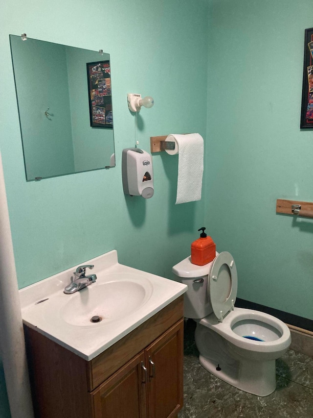 bathroom featuring vanity and toilet