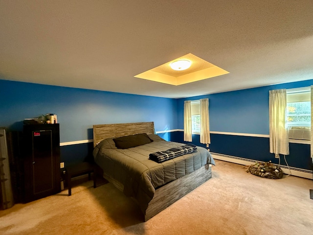 carpeted bedroom with cooling unit, a tray ceiling, and a textured ceiling