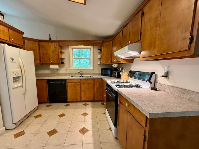 kitchen featuring light tile patterned flooring, lofted ceiling, sink, and black appliances