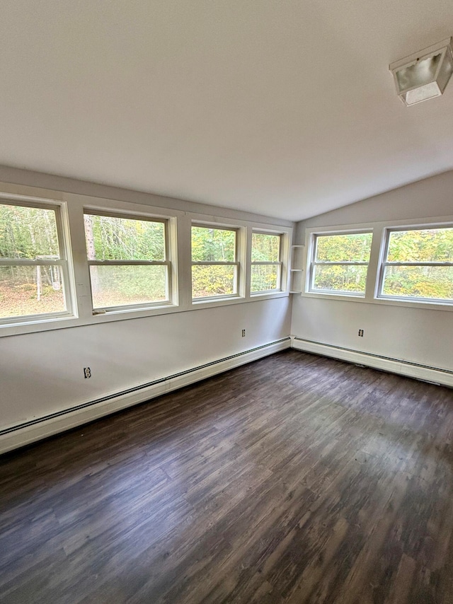 empty room with lofted ceiling and dark hardwood / wood-style floors