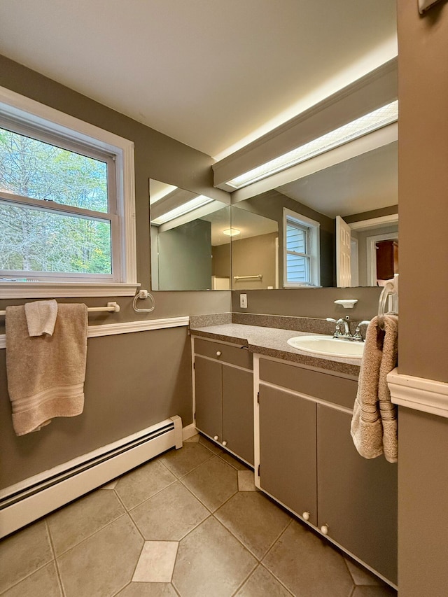 bathroom featuring a baseboard radiator, tile patterned floors, and vanity